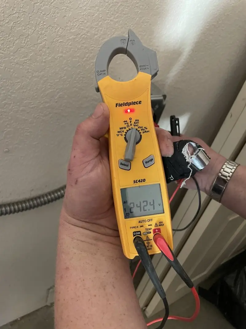 Voltage testing with clamp meter during Generator Installation in Beaverton